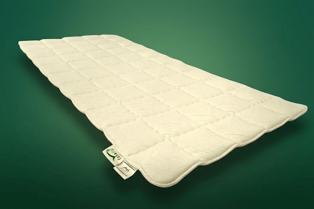 fanello Schurwollauflage mit hexagonaler Steppung